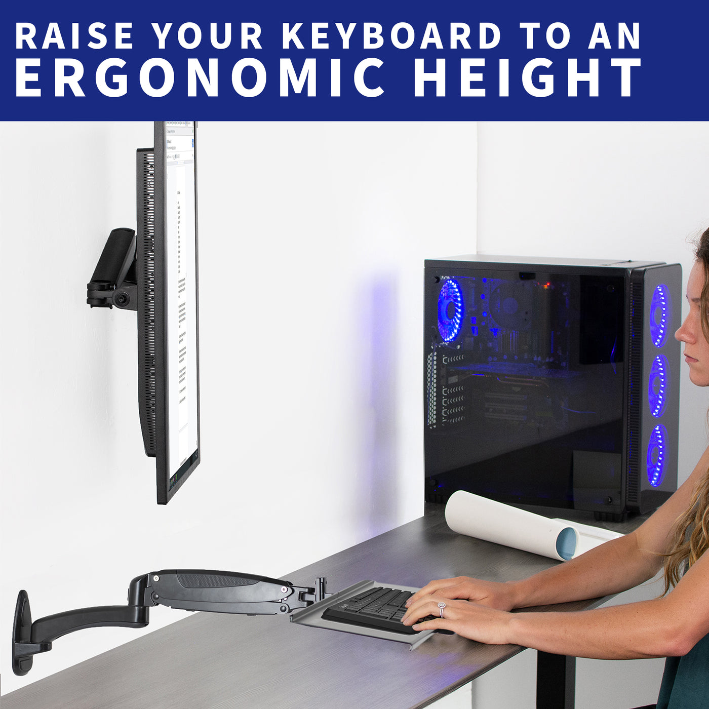 Woman typing from a sturdy wall-mount keyboard tray.